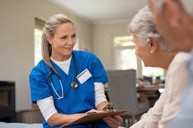 Nurse talking to elder patient